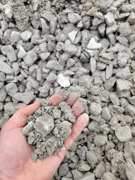Close up of AB-3 crushed limestone base gravel used for patios, retaining walls, base gravel, located in Kansas City. Delivery available.