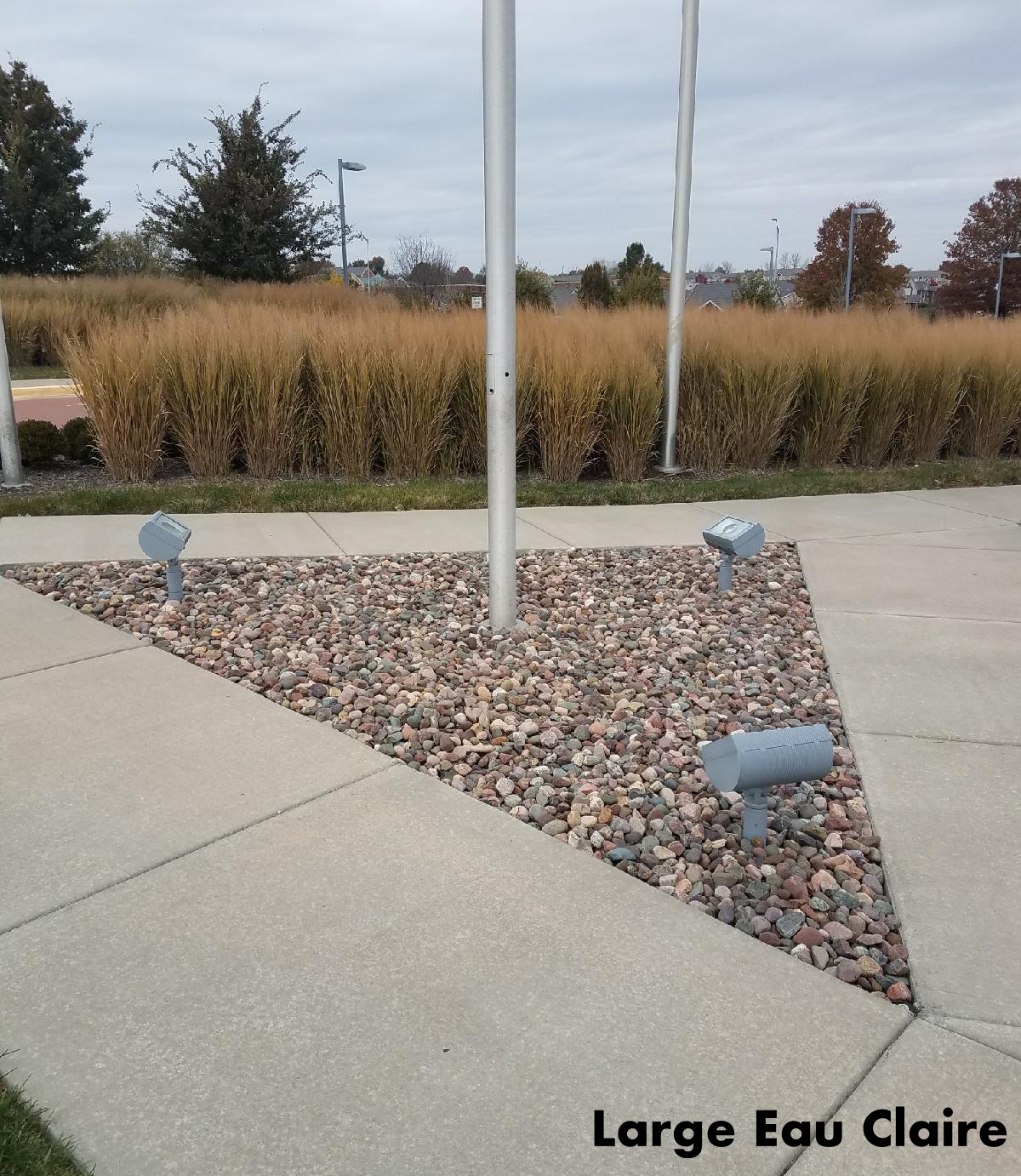 Eau Claire river rock in a landscape bed located in Kansas City