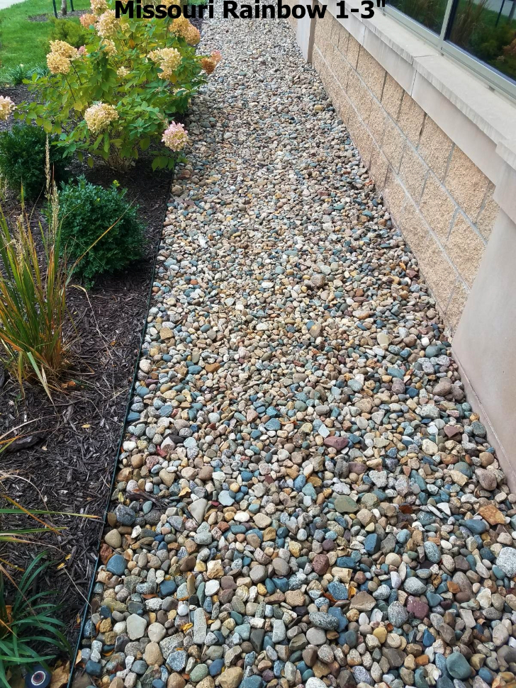 Missouri Rainbow River Rock used in a landscape bed located in Kansas City