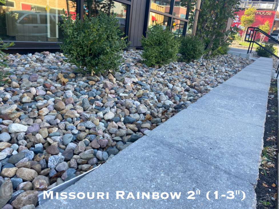 Missouri Rainbow River Rock used in a landscape bed located in Kansas City