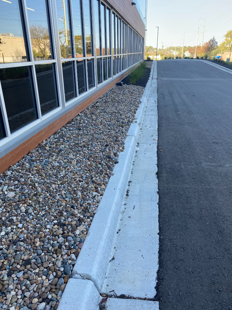 Missouri Rainbow River Rock used in a landscape bed located in Kansas City
