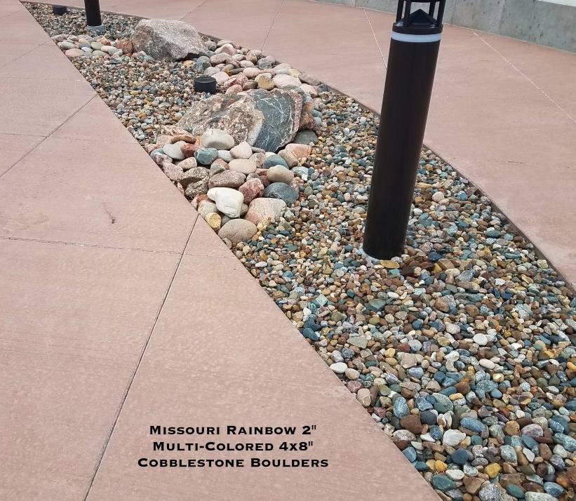 Missouri Rainbow River Rock used in a landscape bed located in Kansas City