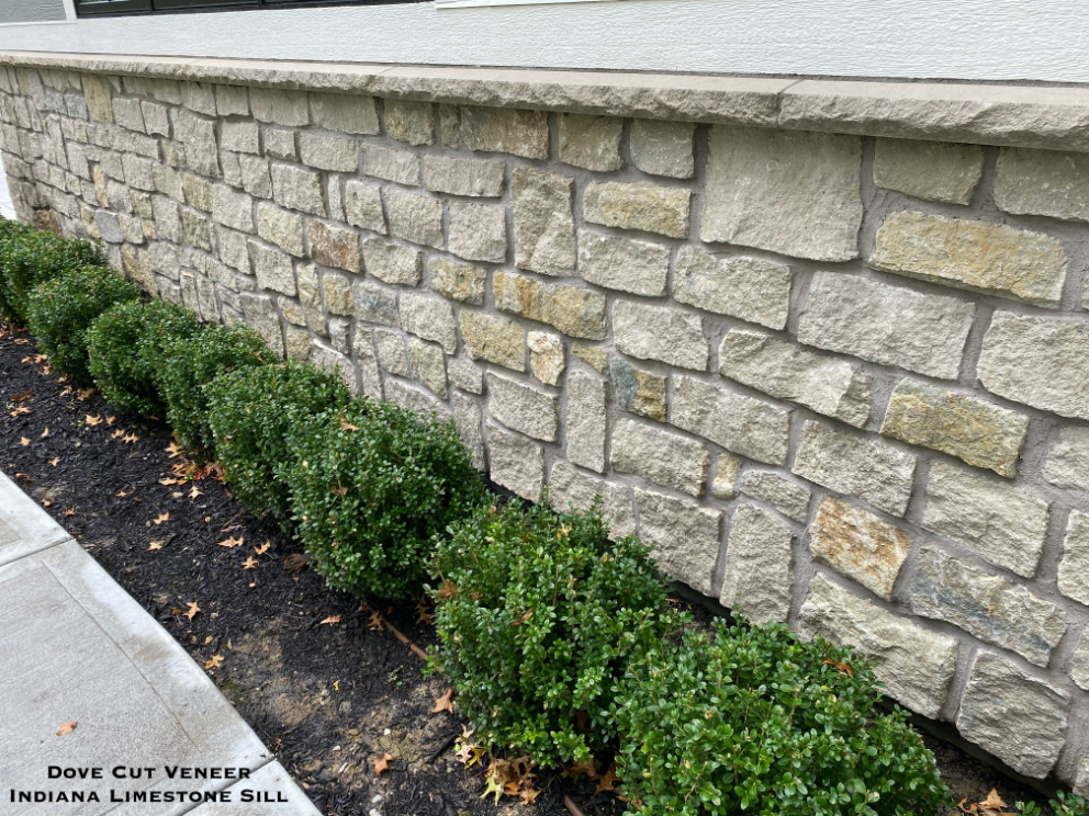 Close up of a Dove Gray Random Ashlar Veneer Wall with a sill