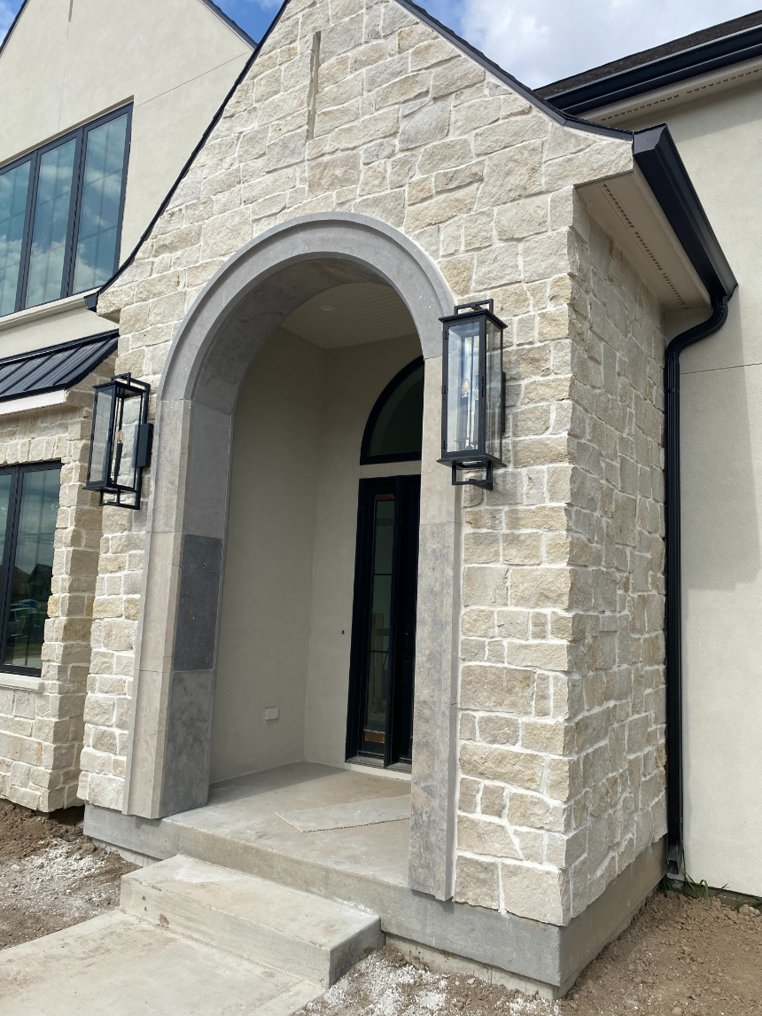 Dove Gray Random Ashlar Veneer on a home entryway with custom natural stone surrounds