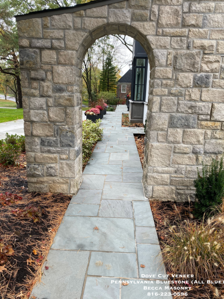 Close up photo of Dove Gray Random Ashlar Veneer with bluestone walkway