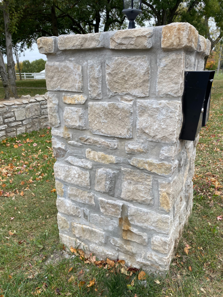 Dove Gray Random Ashlar Veneer on a rustic stone column